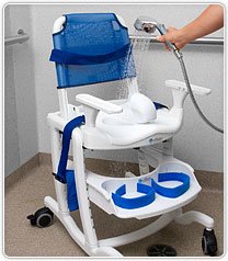 The Rifton Blue Wave mobile shower chair with backrest and footboard being sprayed off in an accessible shower room.