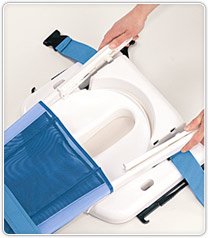 The backrest of the Blue Wave commode chair seat being adjusted to snap into the holes at the very back of the white plastic seat, to make the seat deeper.